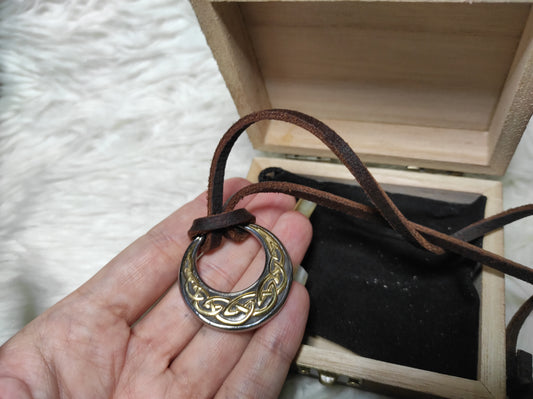 Celtic knot in a circular design on a leather cord