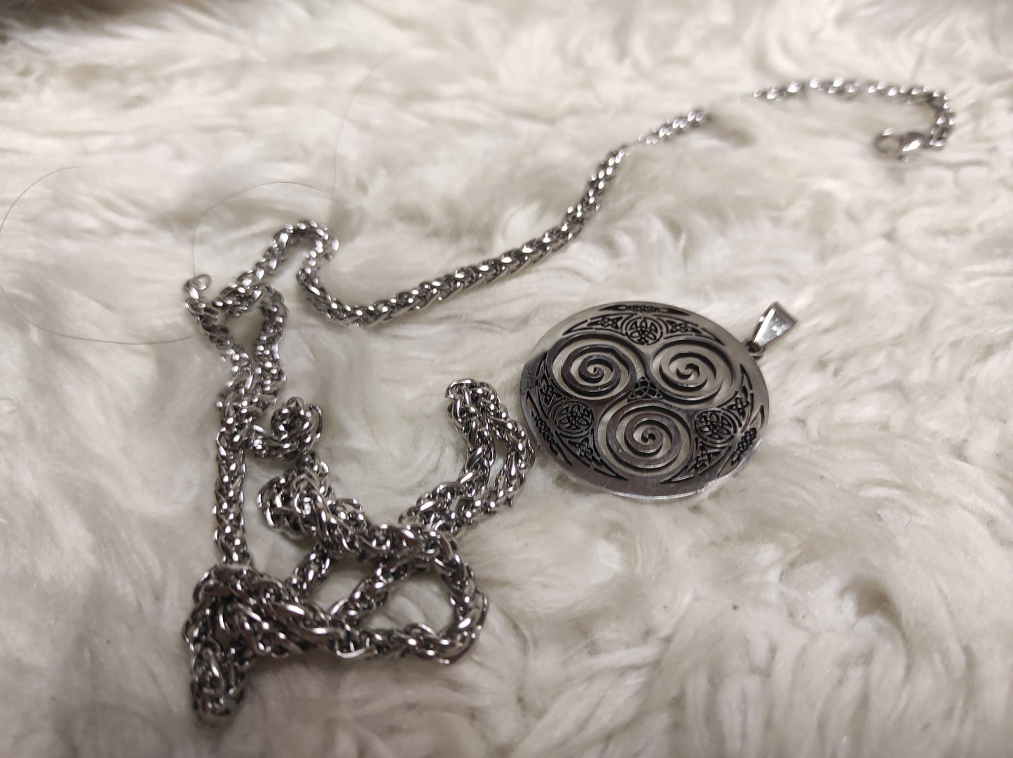 Round silver triskelion