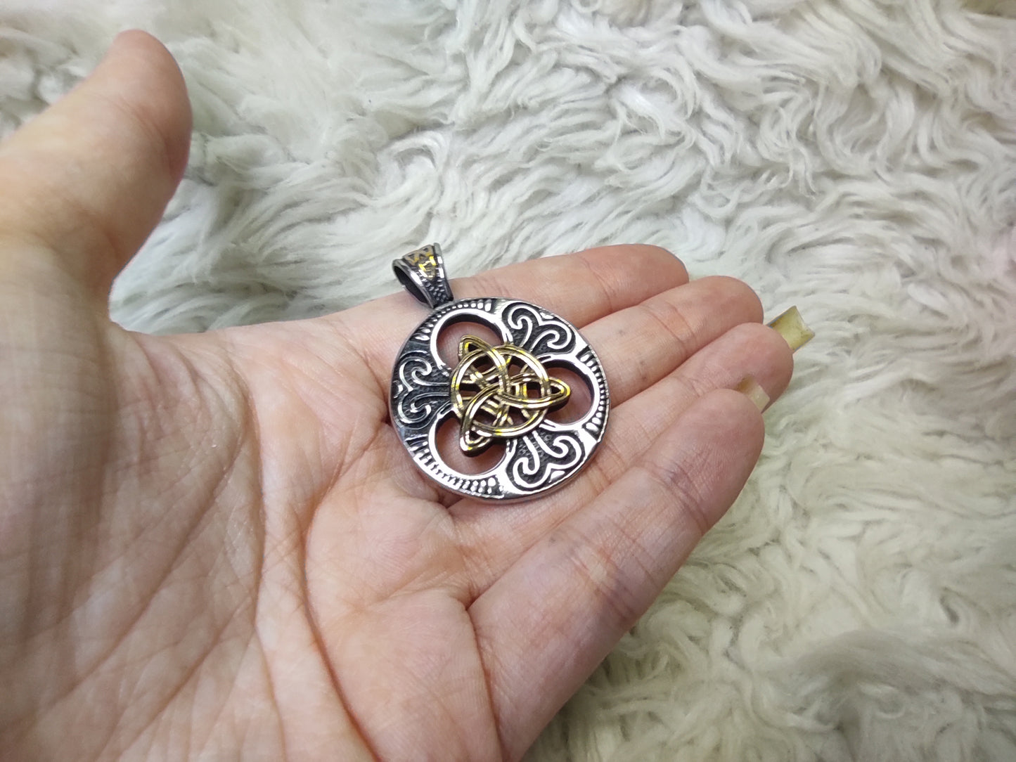 Round amulet with gilded triquetra